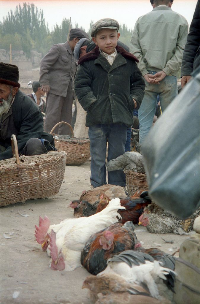 46 Kashgar Sunday Market 1993 Young Boy With Chickens